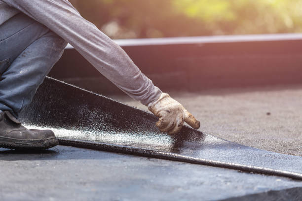 Professional Waterproofing technician working in Stony Brook, NY